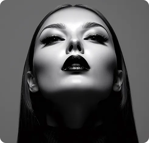 Black and white close-up portrait of a woman with dark lipstick looking upwards, emphasizing her lips and nose.